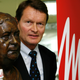 A Bentz descendant shares a cup of coffee with a bust of his ancestor.